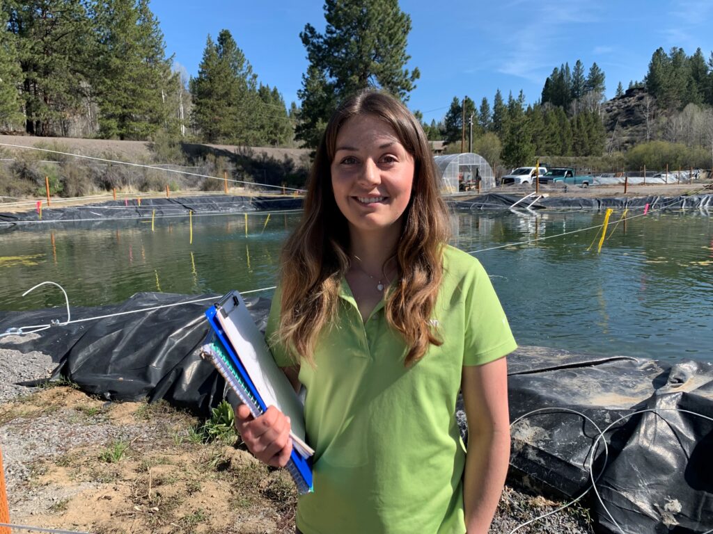Aquaculturist Carlie Sharpes is the newest member of the Klamath Tribes Ambodat c’waam and koptu fish rearing program in Chiloquin. (Photo by Ken Smith/Klamath Tribes. Image available for media use.)