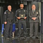 Klamath Tribes Police Officer Zak Jackson stands with two representatives at his DPSST Basic Police Class 465 graduation in Salem.